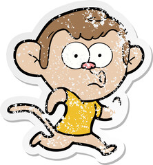 distressed sticker of a cartoon hooting monkey