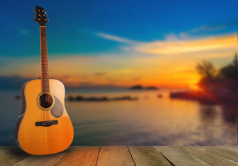 wooden guitar natural view, sea, setting sun Musical nature, wooden floors, travel, views, musical instruments, conveying music and nature.