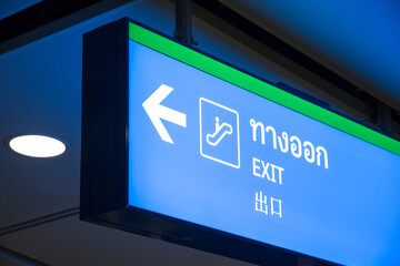 Exit sign with Chinese, Thai and English languages