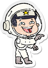distressed sticker of a cartoon laughing astronaut