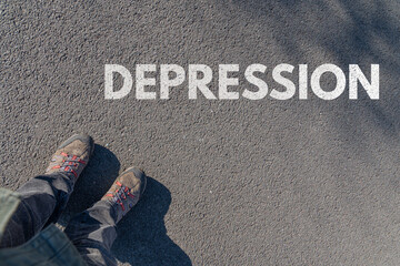 Depression als Schlagwort auf Asphalt