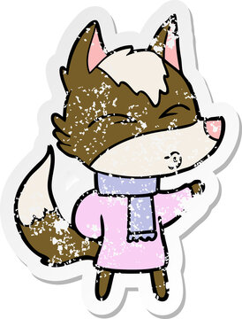 distressed sticker of a cartoon wolf in winter clothes
