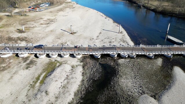 Europe, Italy , Pavia - water emergency and drought aridity - Po Ticino river in shortage of water below the minimum level - climate change and global warming - drone  view Ponte  Chiatte Bereguardo