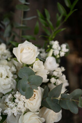 Wedding bouquet of white flowers - ranunculus, freesia, lisianthus.. Wedding. Bride and groom.