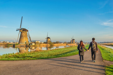 Dutch Windmill landscape at Kinderdijk Village Netherlands - obrazy, fototapety, plakaty