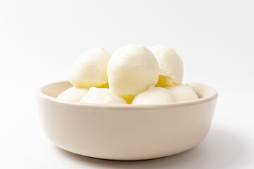 Mozzarella pearls cheese on white background