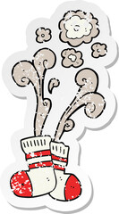 retro distressed sticker of a cartoon smelly old socks