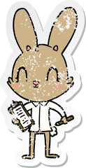 distressed sticker of a cute cartoon rabbit with clipboard