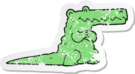 distressed sticker of a cartoon crocodile