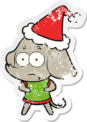 distressed sticker cartoon of a unsure elephant wearing santa hat