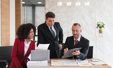 Diverse business team discussing project at corporate briefing in boardroom. colleagues meeting for brainstorming, sharing ideas, together. Teamwork concept