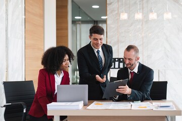 Diverse business team discussing project at corporate briefing in boardroom. colleagues meeting for brainstorming, sharing ideas, together. Teamwork concept