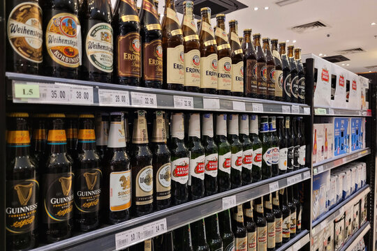 KUALA LUMPUR, MALAYSIA - 12 MARCH 2023: An assortment of imported beer display neatly on store shelves in Jaya Grocery store, Malaysia.