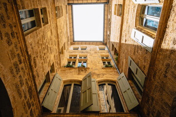 The inner courtyard of a medieval stone townhouse in the old town of Pezenas in the south of France (Herault)