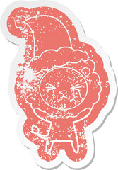 cartoon distressed sticker of a crying lion wearing santa hat