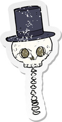 retro distressed sticker of a cartoon spooky skull in top hat