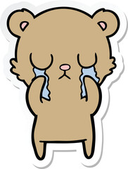 sticker of a crying cartoon bear