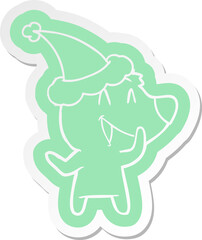 laughing bear cartoon  sticker of a wearing santa hat