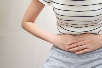 A woman diarrhea excreting in the bathroom at home