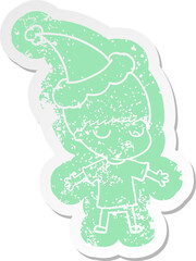 cartoon distressed sticker of a calm boy wearing santa hat