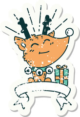 grunge sticker of tattoo style christmas reindeer with present