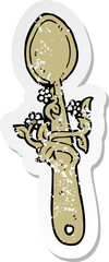 retro distressed sticker of a cartoon wooden spoon
