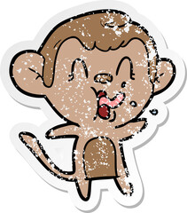 distressed sticker of a crazy cartoon monkey
