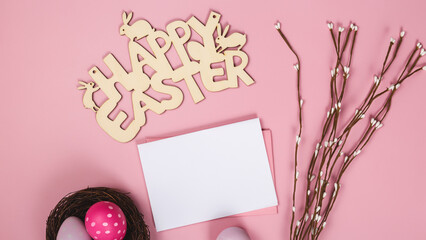 Mockup white greeting card, easter eggs and envelope on a pink background