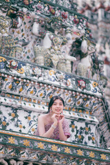 Beautiful Asian girl in Thai traditional costume at temple