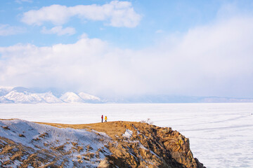 Olkhon Island, Baikal, Russia- February 22, 2023 : people make a wish on the Shamanka stone