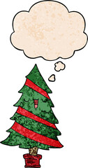 cartoon christmas tree and thought bubble in grunge texture pattern style