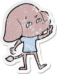 distressed sticker of a cartoon elephant remembering