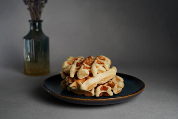 Blue Plate of Homemade Belgian Waffles on Grey concrete Background