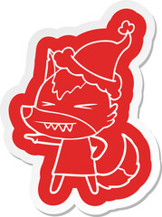 angry wolf cartoon  sticker of a wearing santa hat