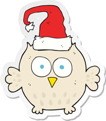 sticker of a cartoon owl wearing christmas hat