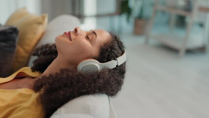 Relax sound, meditation music and woman on a living room couch listening to audio on a sofa. Headphones, radio streaming and peace of a person in a house on a home lounge feeling calm on a work break