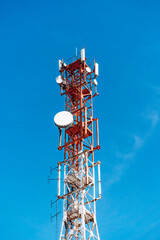 Telecommunications tower and mobile phone signal repeater on top of a mountain