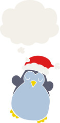 cute christmas penguin and thought bubble in retro style