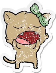 distressed sticker of a cartoon yawning cat