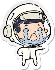 distressed sticker of a cartoon crying astronaut