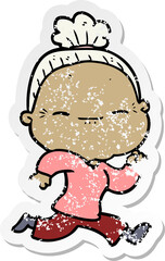 distressed sticker of a cartoon peaceful old woman