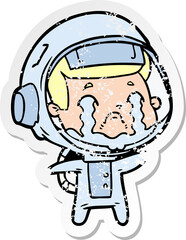 Obraz premium distressed sticker of a cartoon crying astronaut