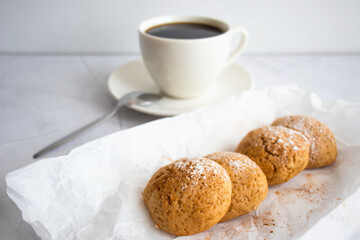 
Photo of oatmeal cookies, cookies, cinnamon, black coffee. on a white table