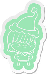 annoyed cartoon  sticker of a girl wearing santa hat