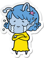 sticker of a cartoon crying alien girl