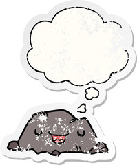 cartoon rock and thought bubble as a distressed worn sticker