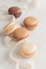 Colorful pastel eco handmade natural macaroons on white table. Gift for 8 March, International Women's Day, Valentine Day
