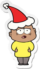 sticker cartoon of a tired bald man wearing santa hat