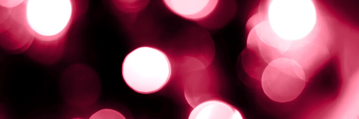 Viva magenta blurred lights abstract panoramic background banner. Holiday defocused bokeh header