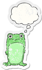 cartoon staring frog and thought bubble as a distressed worn sticker